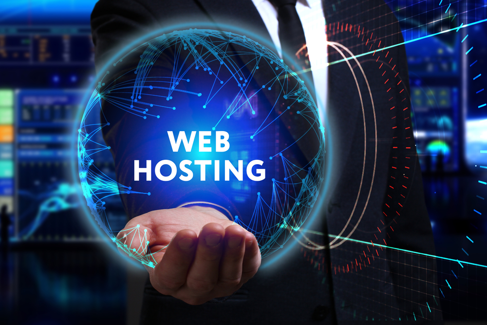guy holding a circle that says web hosting